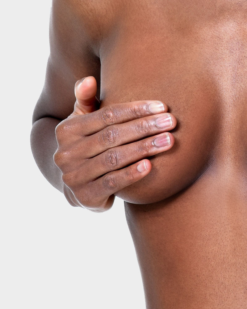 Close up of woman covering breast